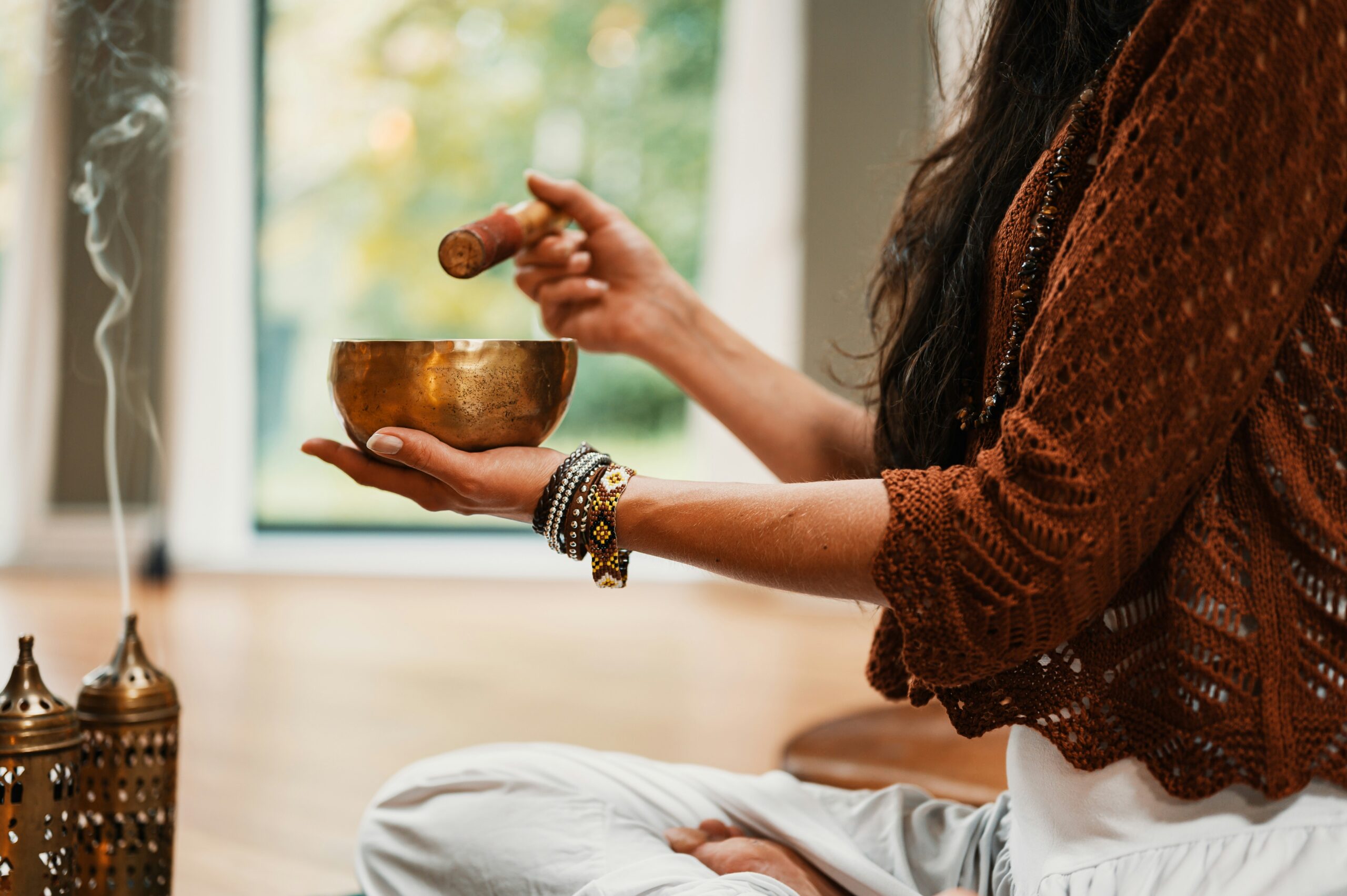 Fall fundraising ideas - meditation session a person burns incense in preparation for a fall equinox meditation session